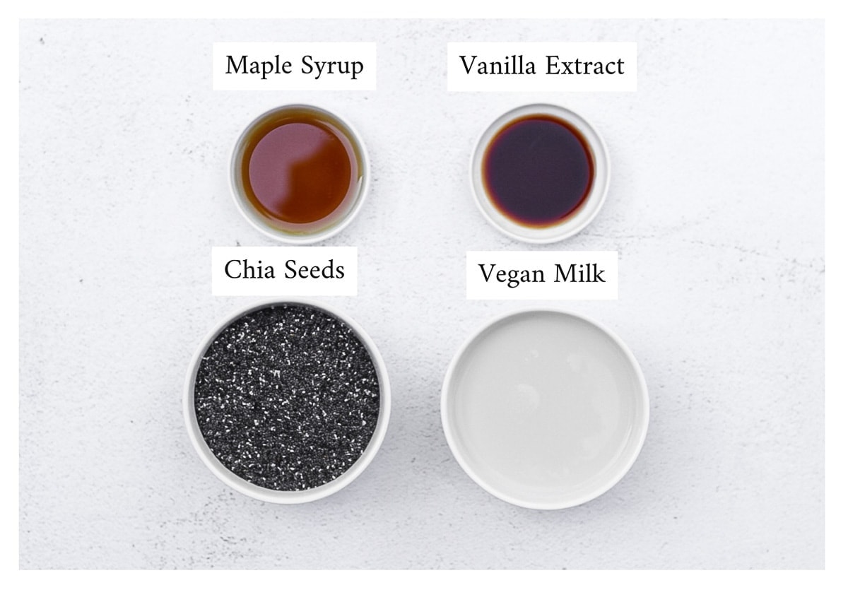Labeled ingredients for chia seed pudding including maple syrup, vanilla syrup, chia seeds, and vegan milk
