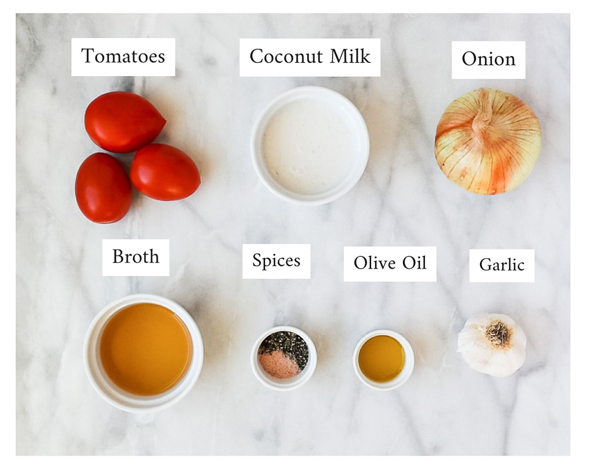 A picture of labeled ingredients including: tomatoes, coconut milk, onion, broth, spices, olive oil, garlic.
