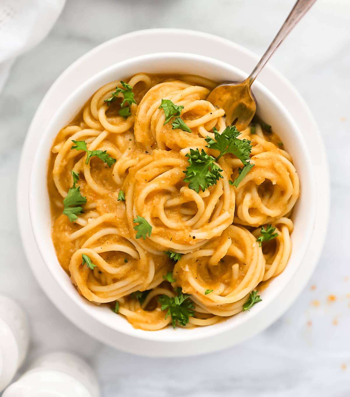 A bowl of creamy orange vegan pasta sauce