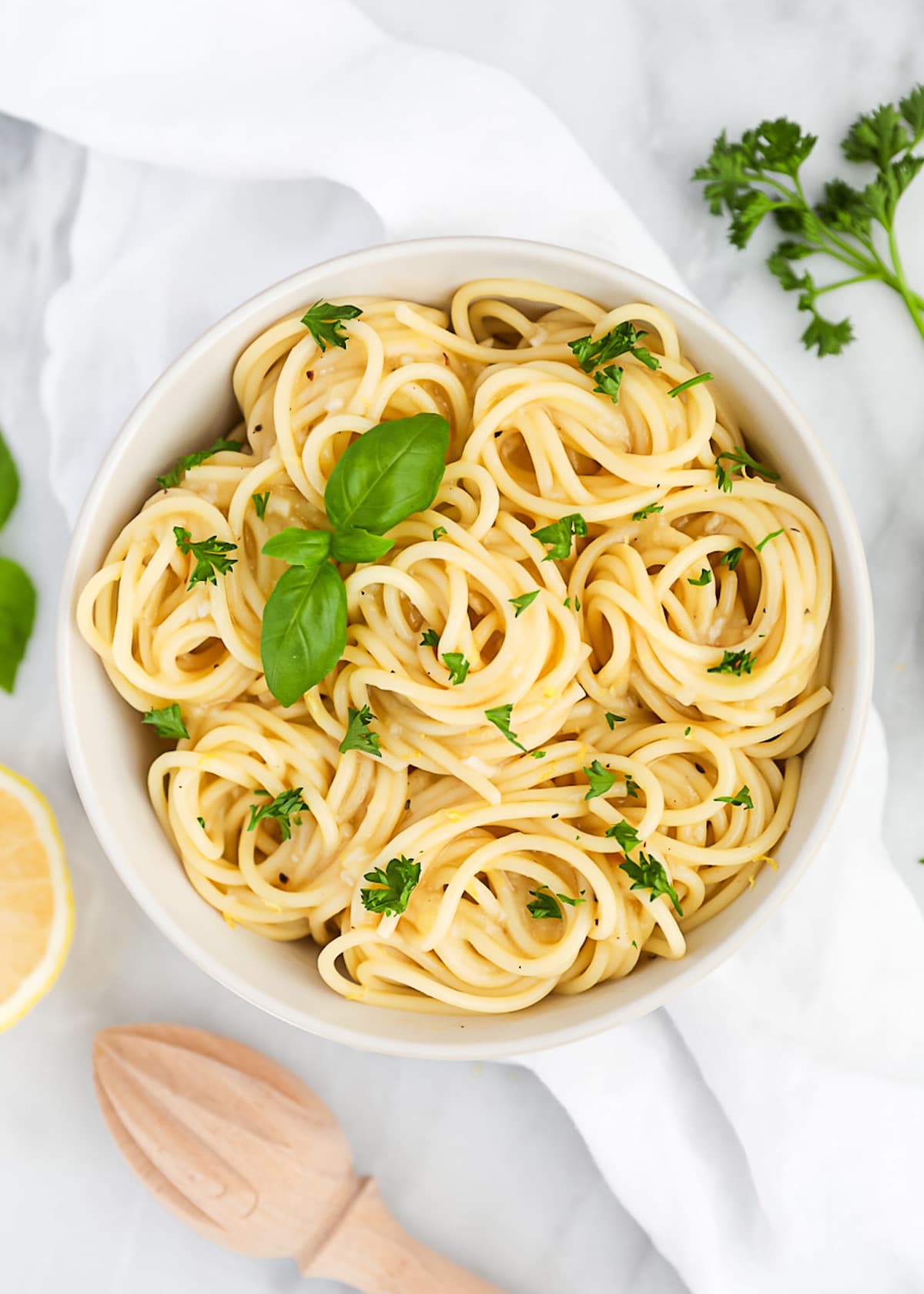 Pasta that has been tossed in a lemon sauce. Garnished with fresh green herbs.