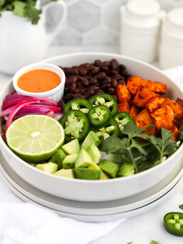 A white bowl filled with plant based taco ingredients