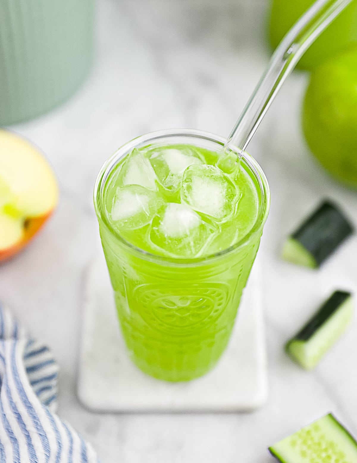 An overhead view of a glass cup filled with juice and ice