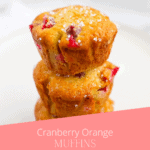A stack of three cranberry orange muffins.