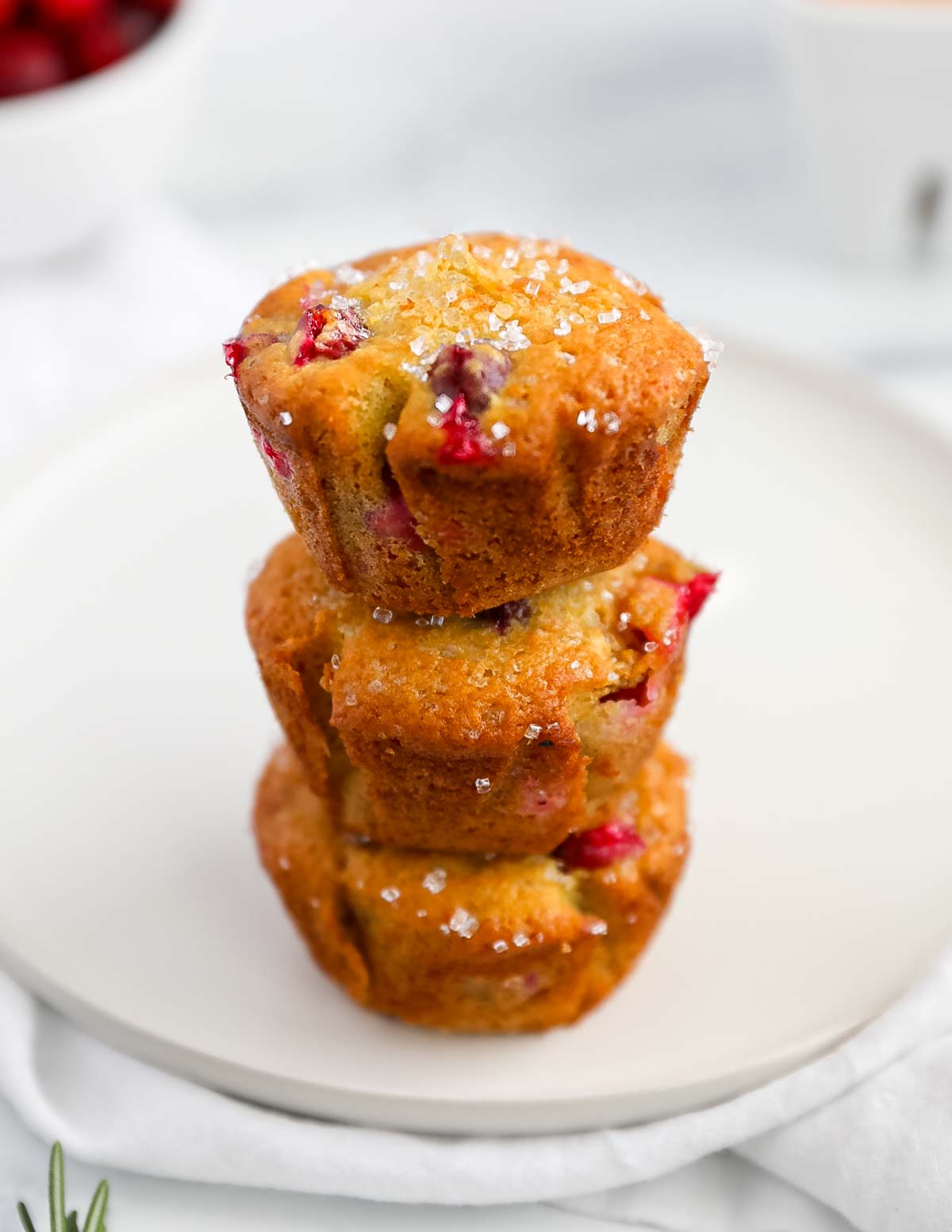 Three muffins in a stack on top of each other.