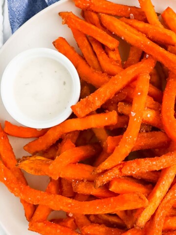 sweet potato fries and a small dish of ranch dressing.