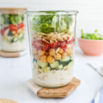 A layered salad in a mason jar.